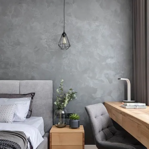 Quarto moderno com parede de cimento queimado em tom neutro, criando ambiente acolhedor e contemporâneo.